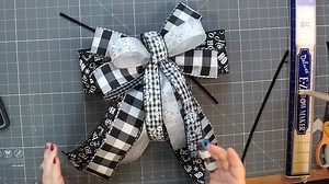 65K views · 997 reactions | Y'all let's hang with Coach Mel as she makes a gorgeous black & white Christmas bow with 4 ribbons -- including 4" ribbon! (Don't be afraid!) What do y'all think? You can do it, right? | DecoExchange | Facebook