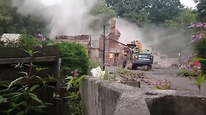 This was the moment last summer when the fire-damaged remains of the iconic Crooked House pub were torn down. Now, the owners have been told they must rebuild the venue after being served an enforcement notice. https://www.expressandstar.com/news/local-hubs/dudley/2024/02/27/crooked-house-owners-told-to-restore-the-building-to-former-glory/ | Express & Star