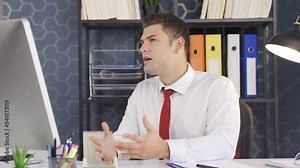 Professional businessman performs a successful business talk at his job. Businessman professional having business meeting in video conference.