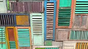 Cool wall abstract art made out of colourful window shutters, fun modern architecture design style, 4K shot