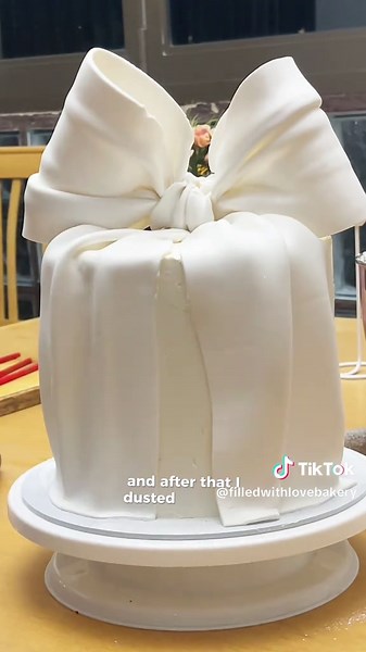 Decorate this really elegant bow cake with me and let me know if you’d like a tutorial on the cake . Message to order your cake . We would love to be part of your special day #bowcake #giantbows #customcakes #cakedecorating #customcakes #caketok #birthdaycakes #bakersofttok #joburgbaker #bakersinjoburg #joburgcakes #cakesinjohannesburg #viralcakes #girlycakes