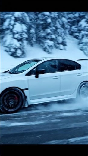 Icy Hairpin Drift: Subaru WRX STI on Snowy Alpine Pass