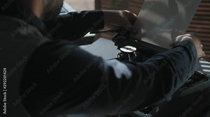 Men load paper in the tray of a typewriter and starts typing. The beginning of creativity. Close-up, typewriter, vintage atmosphere. Taken from the back of unknown man, Stock Video