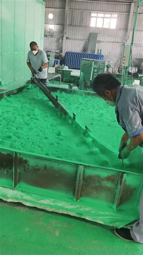 Technology Hype on Instagram: "an industrial powder coating / material mixing process in a factory. Workers are wearing safety masks and gloves while handling a large tank filled with green powder material. A rotating shaft or bar is used to mix and level the powder evenly, ensuring uniform texture and color before the next production step. Such a process is commonly used in powder coating, pigment preparation, or surface treatment, where proper mixing and safety precautions are very important f