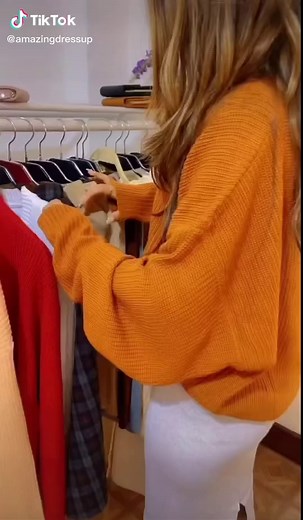 Fashion Try-On: Stylish Sweaters in a Boutique