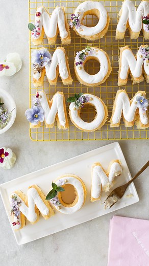 Mini MOM cakes are a festive dessert to make for Mother’s Day! You can use any cake mix or your favorite homemade cake recipe to make these 🌸 Pipe in your favorite frosting and that’s it! COMMENT recipe and I’ll send you more info and the cookie cutters I used (overnight shipping) to make these! MOM Cakes 2 boxed cake mix 16 ounces vanilla frosting 15 edible flowers Follow the directions on the back of the cake box. You’ll use two cake boxes to make this recipe. Pour the cake batter into one 18