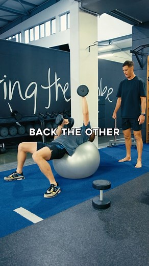 JARED DE THIERRY on Instagram: "Dumbbell Alternating Press on a Swiss Ball A key movement for building real core stability and balance that translates into to surfing. This variation replaces the bench press with an unstable base, forcing your trunk, hips, and shoulders to stay aligned through every rep. Visualise staying in place while pressing the dumbbell. Think about ‘rolling’ on top of the ball, not ‘sliding.’ Engage your core, rotate your chest, and stay reactive through the whole press. N