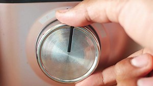 Download Closeup of a Modern Design Microwave Timer Dial with intricate functions for free