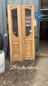 Antique doors are a great way to update your space. Beautiful hand-carved details add a hint of elegance to this pair! Two matching pairs like shown. Double doors with hand-carved details and curved iron work. Pine wood. Circa 1890’s. 43” wide total by 8’ high. $1875 per pair. | Charles Phillips Antiques and Architecturals
