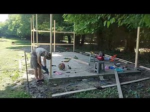 Building a very small house cheaply, post frame wooden with cement board. First Phase