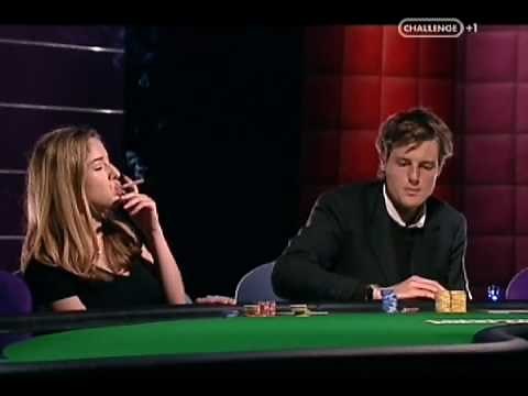 Woman smokes while playing cards