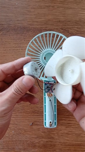 Reassembling a broken mini fan I found in a pile of old things.