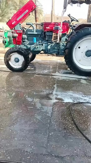 Tractor Washing Process with High-Pressure Hose
