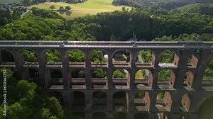 Aerial View at sunset of a Brick Bridge and Railway track in Western Germany crossing the Goltzsch Valley. Göltzschtalbrücke, Göltzsch Viaduct