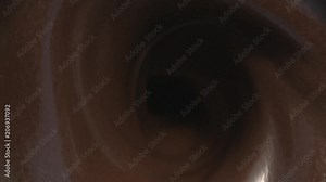 Whirlpool of Chocolate macro tabletop in slow motion splashes and swirl Stock Video