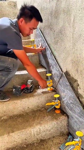 Installing Large Wall Tiles Using Precision Leveling Tools For Seamless Finish