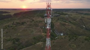 Cell site of telephone tower with 5G base station transceiver. Aerial view of telecommunication antenna mast