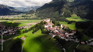Aerial shot of the castle in Gruyeres (Switzerland). The drone is panning around the castle. The Castle of Gruyeres is also home to the museum of H. R. Giger.