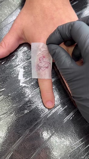 Micro Sacred Heart Finger Tattoo