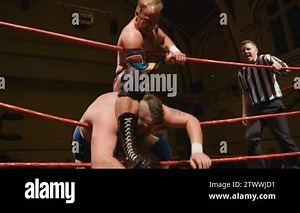 Pro Wrestling Match (Slow Motion): Wrestler Choking Opponent on Ring Ropes Stock Video Footage - Alamy