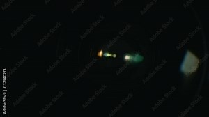 Camera lens reflection macro with color lens flare. LED lamp