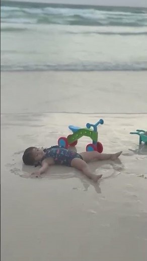 Luca making Sand Angels at the beach