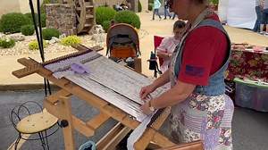 Tiffany Hopper of Aunt Tiffy’s Twined Rag Rugs of Mansfield is demonstrating the art of making rag rugs on and old-fashioned twining loom. Her booth is in the Century Bank of the Ozarks parking lot. | Ozark County Times