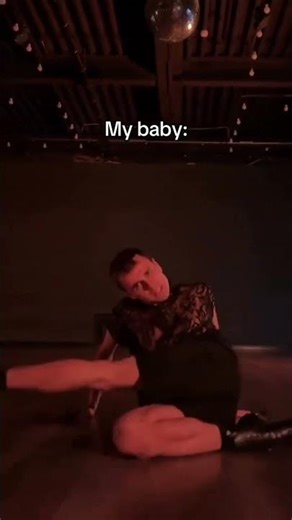 A mom's patience vs. a wiggly baby during a diaper change.