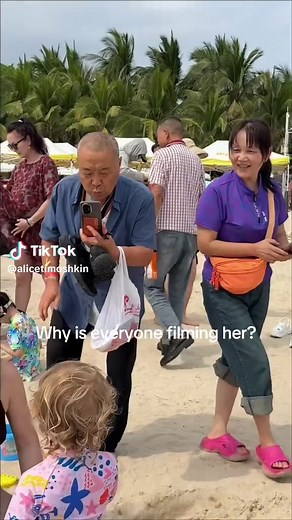 Unexpected Beach Moment: Chinese Baby Girl