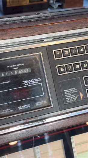 28K views · 188 reactions |  When music was chosen, not streamed. A vintage jukebox that once ruled cafés and dance halls — every button a memory, every song a moment in time. From woodgrain charm to mechanical soul, this piece is more than décor… it’s history that still knows how to play. ✨ | Démodé | Facebook