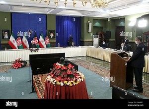 Tehran, Iran. 10th Dec, 2020. A handout photo made available by the official website of the Iranian presidential office shows Iranian President Hassan Rouhani attending via a video link the inauguration of the Herat-Khaf railway operations linking Iran and Afghanistan, in Tehran, Iran, 10 December 2020. The Herat-Khaf railway, officially opened on 10 December, is 130kms long track connecting Iran's eastern city of Khaf to Afghanistan's western Herat province, providing a crucial transport link f