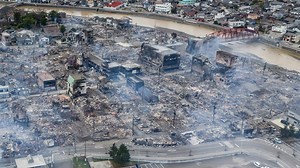 Japanese rescuers race to find survivors after New Year's Day quake kills dozens