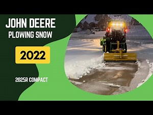 John Deere 2025R Plowing Snow with Rear Blade in Warm Cab