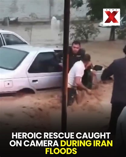 Dramatic footage from Izeh, Iran, shows a man risking his life to rescue a family, including a child, after their car became trapped in severe flooding on Tuesday. The courageous act unfolded amid rapidly rising waters, highlighting the dangers faced during the floods. #IranFloods #Izeh #HeroicRescue #BreakingNews #FloodEmergency #WorldNews | NewsX