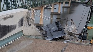 Driver missing after tractor-trailer crossed 3 lanes and plunged into river