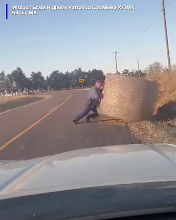 12M views · 261K reactions | A state trooper got his leg workout in for the day moving this big hay bale out of the road! https://tinyurl.com/5a4urhhk | WSMV 4, Nashville | Facebook