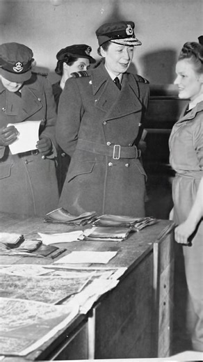 Director of the WAAF Air Chief Commandant Lady E. M. E. Welsh talking with Leading Aircraftwoman Marjorie Nixon in the Sorting Room of the 2nd Tactical Air Force Photographic Negative Library at Keerbergen, Belgium, mid-1945; Wing Officer A Stevens stands to the left of Welsh. #ww2 #aviation #military | World War II Aircraft