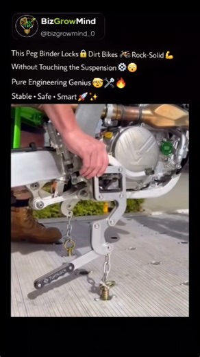 BizGrowMind on Instagram: "The bike isn’t strapped down, it’s mechanically locked. 🔒⚙️ This peg binder clamps directly onto the footpegs, anchoring the bike upright without compressing the suspension at all. Instead of stressing forks, seals, and tie-down points, the load is transferred straight through the frame into the trailer deck. That means less wear during transport, faster setup, and a release system that takes seconds, not minutes. No front wheel chocks. No ratchet straps pulling the b