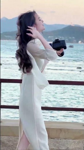 Elegant Beach Walk with Camera 📸 | Beauty in White Dress by the Sea 🌊✨
