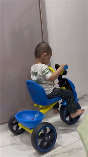 Learning to ride tricycle.