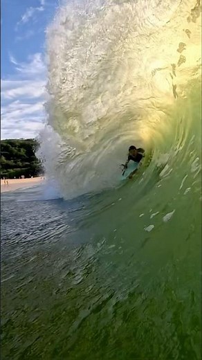 Grom handles the Waimea Bay shorebreak. Waves were dredging over the river mouth sandbar. 💚🤙