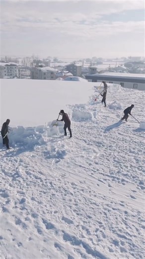 Winter Challenge: Snow Removal from a Flat Building Roof by Hand