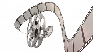 Premium stock video - Film rolling out of a film reel