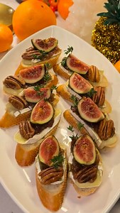 Brie & Fig Crostini (Holiday Appetizer) Warm brie crostini topped with fig jam, figs, and pecans — perfect for the holidays. Ingredients • Baguette bread, sliced • Brie cheese, sliced • Fig jam • Fresh figs, sliced into quarters • Pecans, chopped or whole • Fresh thyme, for garnish ⸻ Instructions 1. Preheat oven to 375°F (190°C). 2. Slice the baguette and arrange the bread on a baking sheet. 3. Place a slice of brie cheese on each piece of bread. 4. Bake for 5–7 minutes, until the cheese is soft