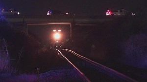 Adult and 4-year-old passenger dead after SUV crashes and falls onto train tracks, gets hit by train