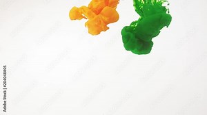 Paint moving in water, white background. Green, yellow acrylic ink swirling in water. Traces of abstract colourful clouds of paint dissolving in water, ever changing shape. Shot at 60fps, HD format