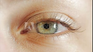 Extreme close up human eye iris in 4K UHD video. Human eye iris contracting. Extreme close up. 4K UHD 2160p footage.