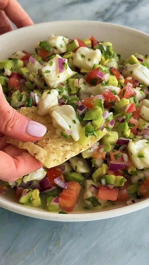 Ceviche is one of my favorite Mexican dishes, and I love making it at home to serve to guests with tortilla chips. This version is a simple blend of lime-marinated white fish (though you could also use shrimp) along with tomatoes, cucumber, onion, avocado, and cilantro. It’s the ultimate ceviche! 🤗 Recipe at: https://downshiftology.com/recipes/ceviche/ | Downshiftology