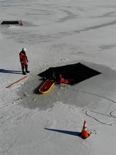 Ice rescue doesn’t start on the ice. It starts long before that, with preparation and purpose. Before firefighters ever step onto frozen water, they begin in the classroom, learning what cold-water victims experience, how they may react, and the specific roles each rescuer plays. From there, training moves hands-on: getting familiar with the specialized gear, testing suits for proper fit, and perfecting how to suit up quickly and efficiently Next comes the firehouse training you see here, runnin