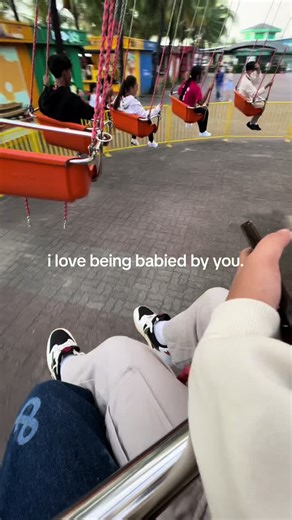 Enjoying Amusement Park Swing Chairs and Fun Times